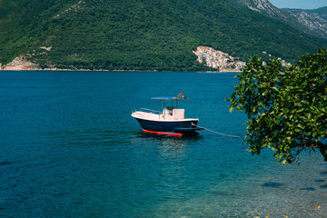 Fototapeta na wymiar Wooden boats on the water. In the Bay of Kotor in Montenegro. Marine boats.