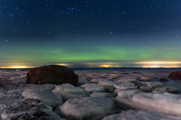 Aurora borealis. Northern Lights. Polar lights and ice floes. Ladoga. Russia St. Petersburg.