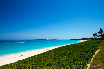 A beautiful view of the ocean and the beach during a bright sunny day. New Providence, Nassau, Bahamas.