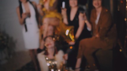 Crazy party time of seven beautiful stylish women in elegant casual outfit celebrating new year, birthday, having fun, dancing,drinking alcohol cocktails. Balloons on white Background. Hen party