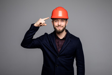 Young construction worker pointed on hard hat