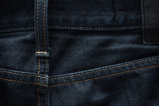 Dark blue jeans fabric background