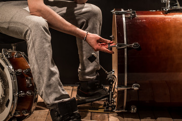 Fototapeta na wymiar man adjusts percussion instruments, creative music concept