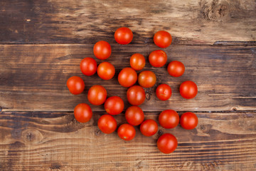 Fototapeta na wymiar tomatoes on wood