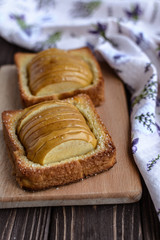 Baked apples with toast on a rustic background