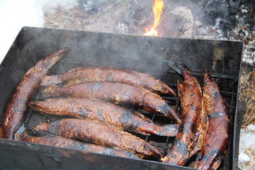 Smoked fish pike in smokehouse.