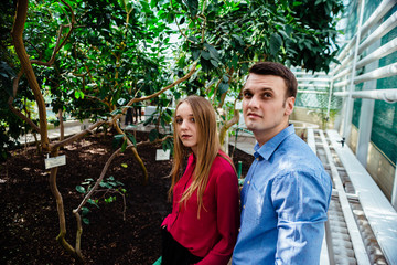 young couple in botanical garden