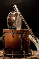 musical instruments, drum bass Bochka bass guitar on a black background