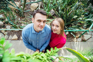 young couple in botanical garden