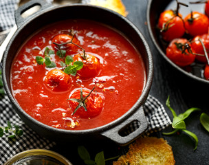 Tomato soup with baked tomatoes, top view