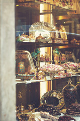 Rich variety of chocolates and candies in display window  of italian pastry shop