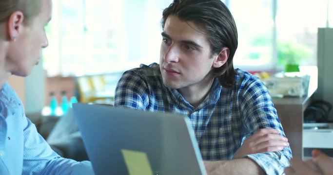 senoir investors and young software developers at meeting