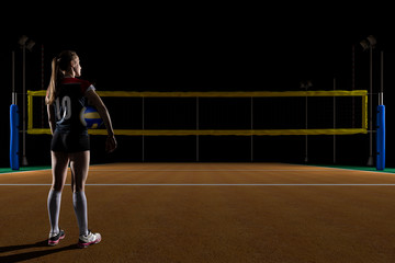 Female volleyball player standing with the volley ball - Powered by Adobe