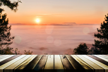 Empty wooden table with blurred sea mist and mountain background. Product display template