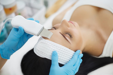 Woman having facial treatment in beauty salon