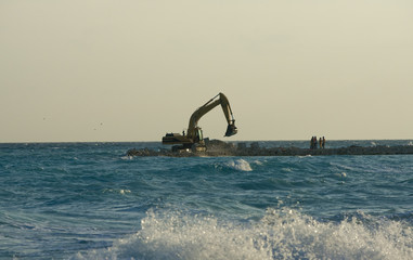 Fototapeta premium Yellow Excavator at Work
