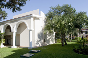 View of house with tropical plants