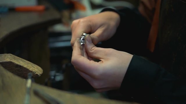Master completes making the ring and proceeds to the final stage of polishing the product