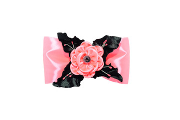 Kanzashi. Pink artificial flower on a bow isolated on white back