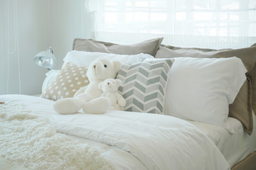 Teddy bear on bed in kid bedroom pastel style