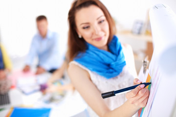 Portrait of attractive female designer in office