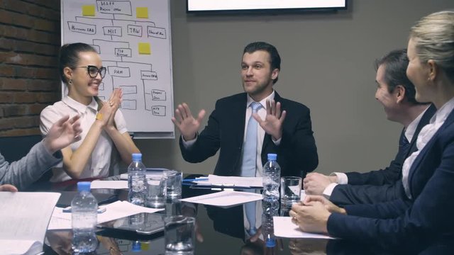 Boss reports good news to employees