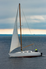 Fototapeta premium White sailboat traveling in Baltic sea