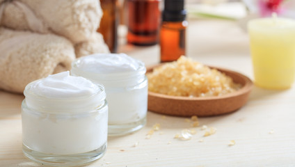 Obraz na płótnie Canvas Variety of creams and bath salt - spa concept