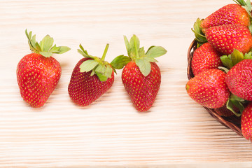 red strawberries on the table from the bowl