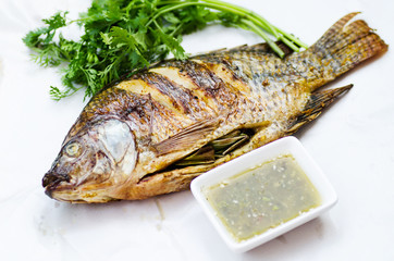 Grilled fish and spicy seafood sauce