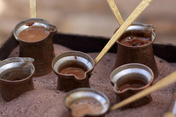 coffee pots at sand
