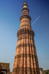 Fototapeta na wymiar Qutub Minar in Delhi is the world's tallest rubble masonry minaret. Qutb Minar and the historic medieval monuments surrounding it form the Qutb Minar complex, which is a UNESCO World Heritage Site.