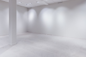 Spot lights and empty white wall as copy space
