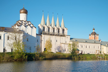 View of a belltower of the Tikhvin Uspensky monastery in the October evening. Tikhvin, Russia