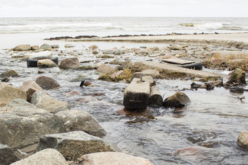 A polluted river flowing into the World Ocean.