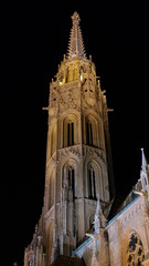 Fototapeta na wymiar Bottom view of Matthias Church tower, night scene, Budapest