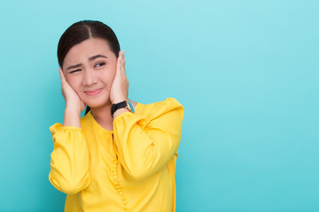 Fototapeta premium Asian woman close her ears