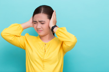 Asian woman close her ears