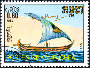UKRAINE - CIRCA 2017: A postage stamp 0.80R printed in Cambodia shows old sailing ship Nile barge,...