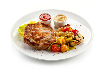 Roast steak on white plate