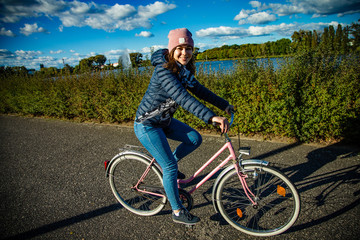 Fototapeta premium Girl biking in city
