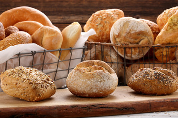 Different types of rolls on wooden background