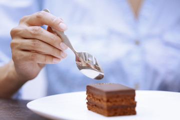 Woman eating chocolate cake