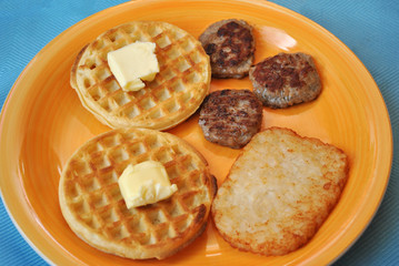 Unhealthy Breakfast Served on a Yellow Plate