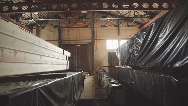 LVL Laminated Veneer Lumbe. Large hangar with the production line for wood. the production of laminated veneer lumber. The interior of the production hall in the woodworking factory.