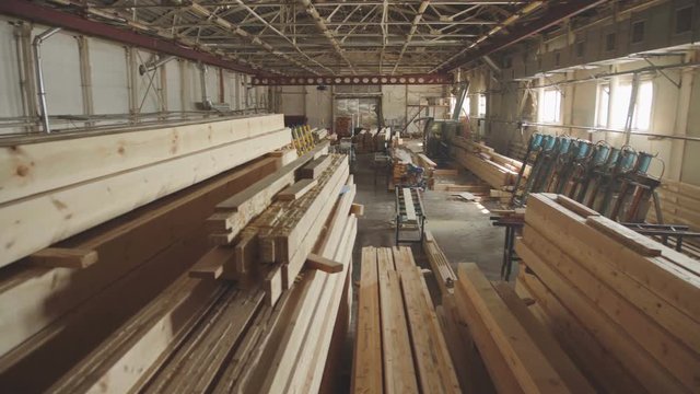 LVL Laminated Veneer Lumbe. Large hangar with the production line for wood. Wood Factory general plan: the production of laminated veneer lumber. The interior of the production hall in the woodworking