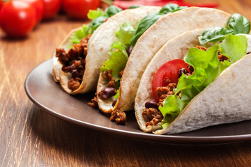 Mexican tacos with minced meat, beans and spices