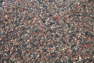 Texture of a wet stone road