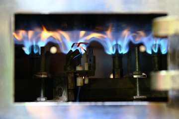 Flames inside a drum type coffee roaster