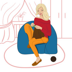 Woman sitting and knitting. Woman sitting in a chair
